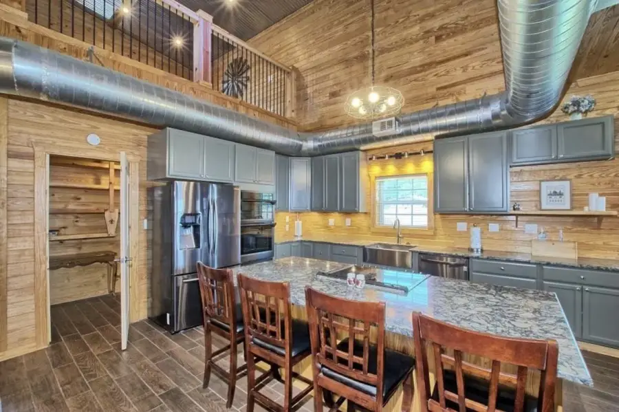 Large kitchen with double ovens, quartz counter tops and huge pantry. Large kitchen with double ovens, quartz counter tops and huge pantry.